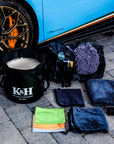 K&H 20 litre black collapsible bucket filled with soapy water