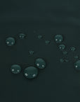 Clear water droplets on dark green textured fabric in The Socialite Picnic Set