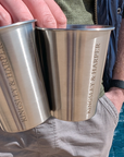 Two brushed stainless steel tumblers, each engraved with the name ’kingsley & harper’ in a clean sans-serif font.