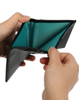 Black leather tri-fold wallet with teal lining in The Commuter Travel Set