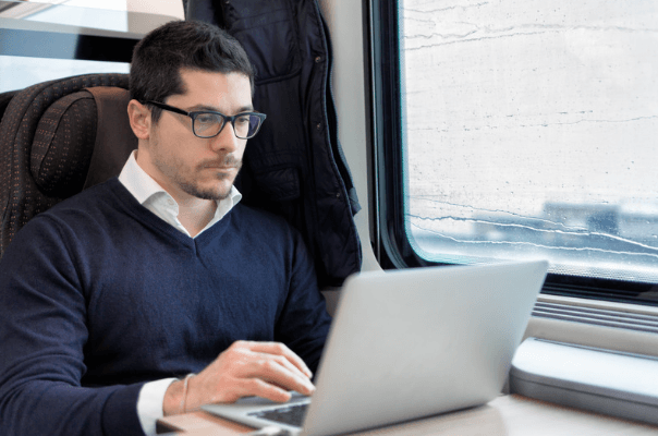 man commuting by train