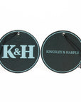 Two circular black bags with 'K&H' and 'Kingsley & Harper' text on a white background