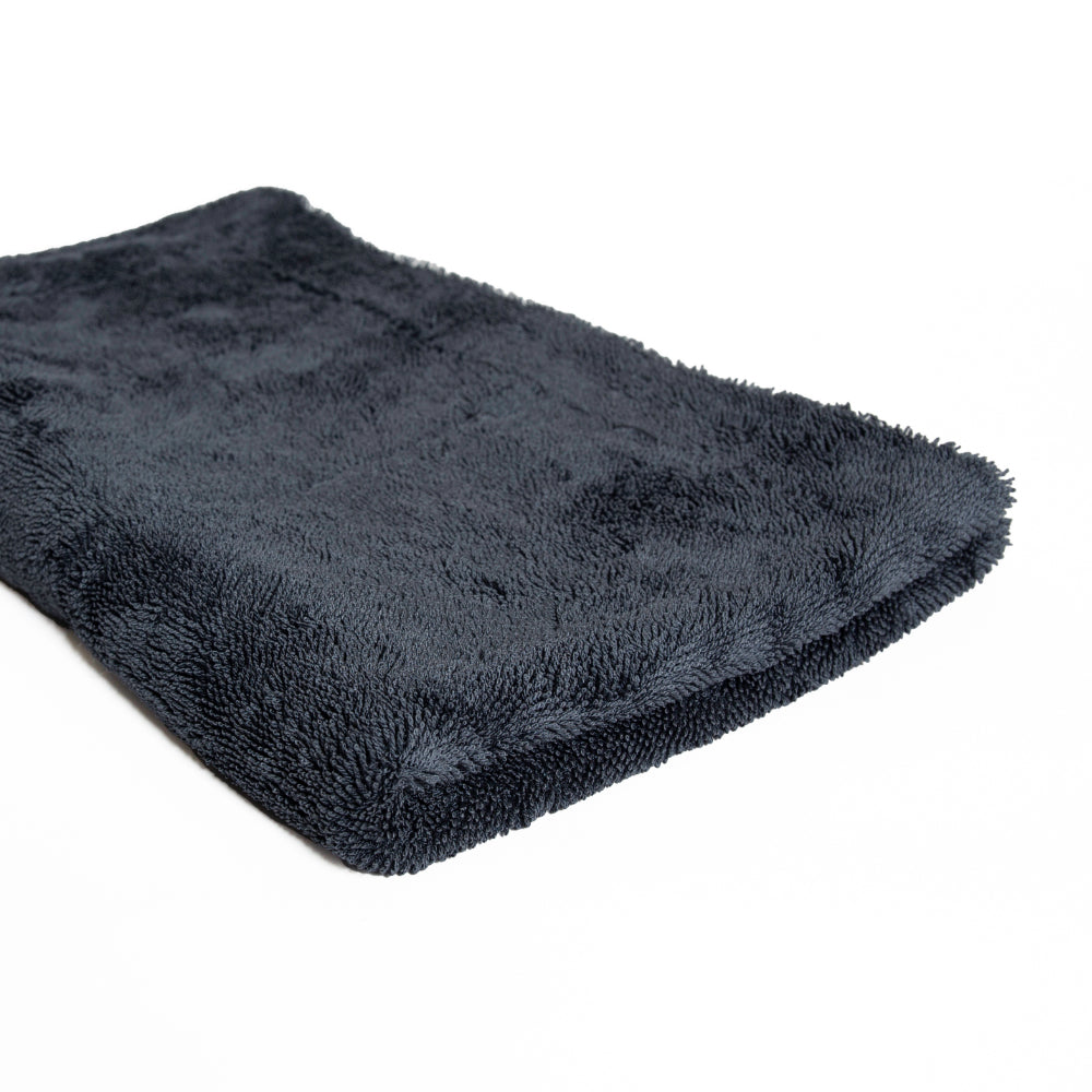 Dark gray plush blanket comes with The Detailer Car Cleaning Set on a white background