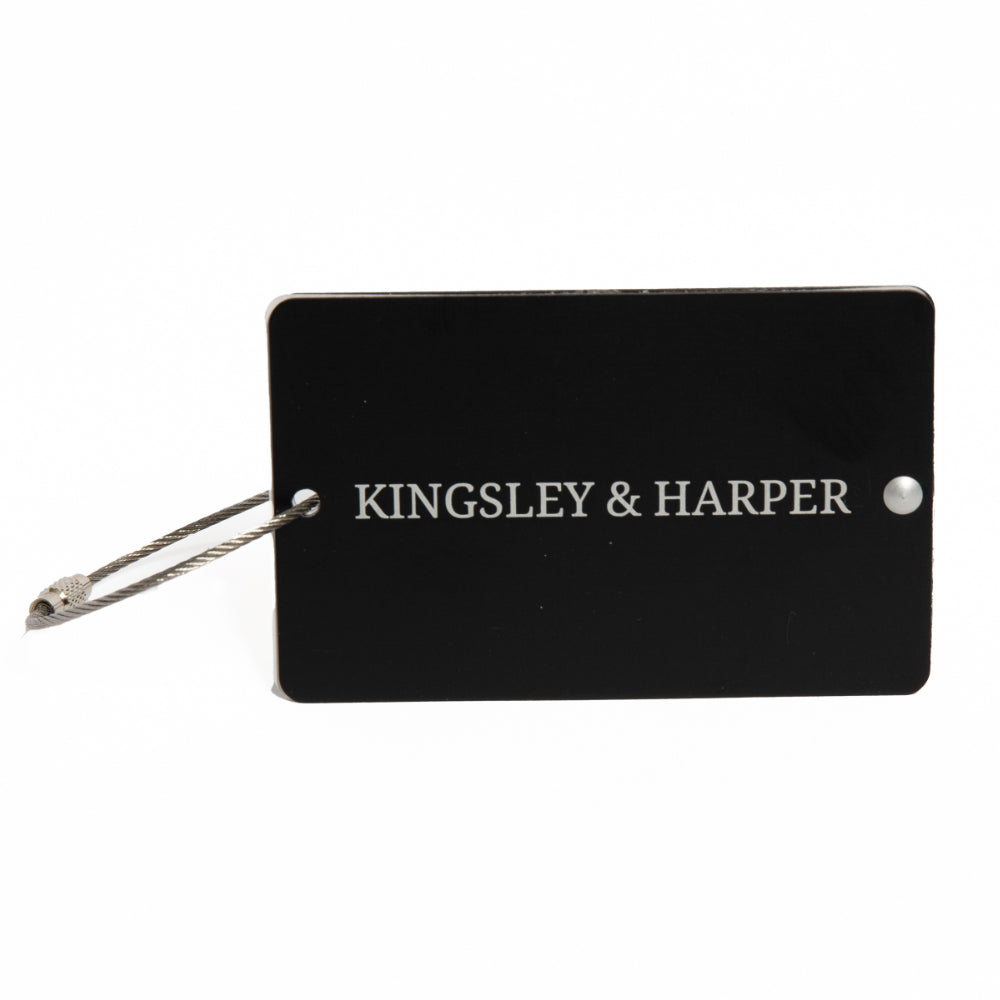 Black rectangular luggage tag with silver lettering from The Globetrotter Travel Set